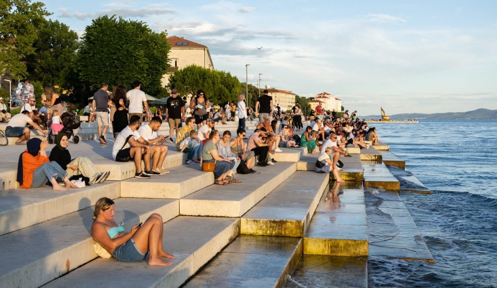 People enjoy the sunset in Zadar, Croatia June 11, 2023. REUTERS/Antonio Bronic