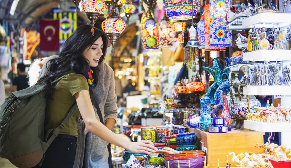 Young tourist couple shopping in in Grand Bazaar, Istanbul, Turkey