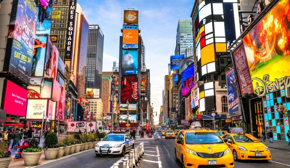 NEW YORK CITY - DEC 01 Times Square ,is a busy tourist intersection of neon art and commerce and is an iconic street of New York City and America, December 01th, 2013 in Manhattan, New York City.